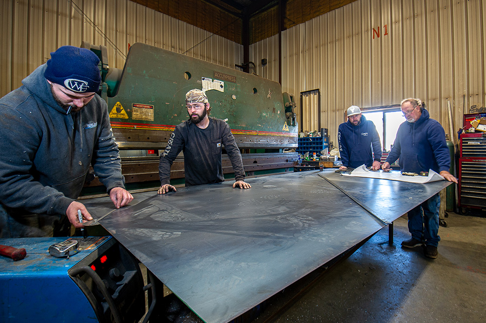 Creative Welding and Fabrication team discusses project