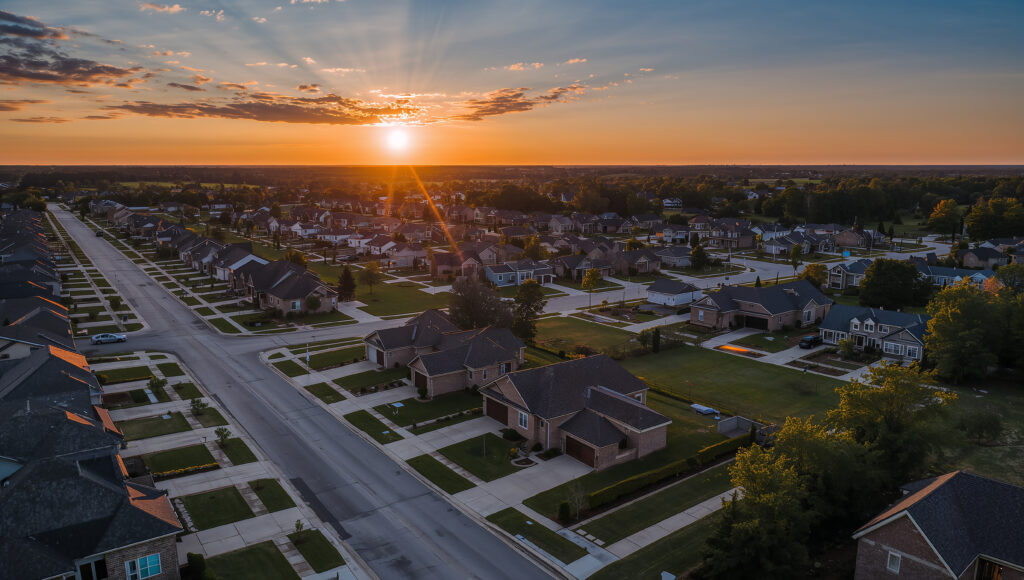 Aerial View of Suburban Homes at Golden Hour